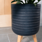 Fenne woven planter on legs in dry green and black, handcrafted from sustainable materials for indoor use