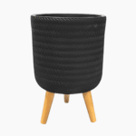 Fenne woven planter on legs in dry green and black, handcrafted from sustainable materials for indoor use