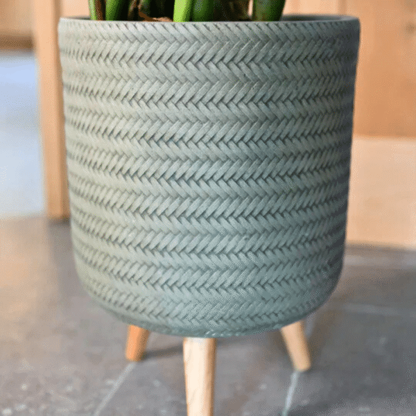 Fenne woven planter on legs in dry green and black, handcrafted from sustainable materials for indoor use