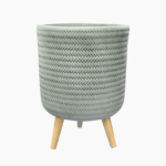 Fenne woven planter on legs in dry green and black, handcrafted from sustainable materials for indoor use